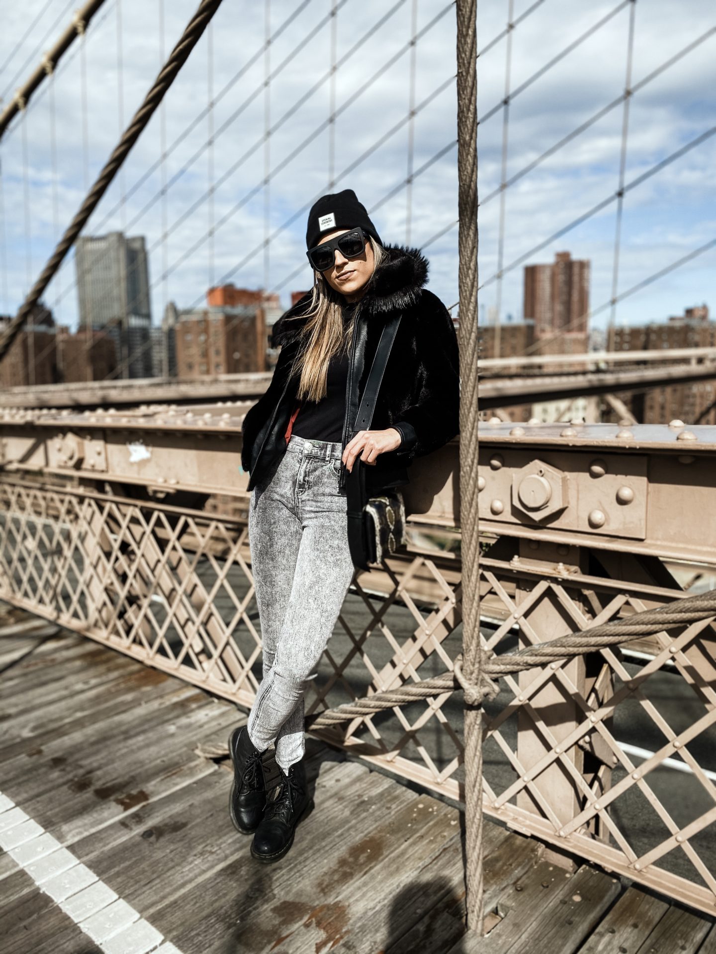 Brooklyn Bridge black fur coats & winter beanies