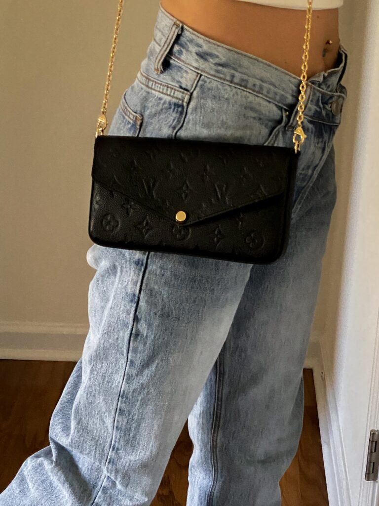 princess polly asymmetric jeans and Louis V bag